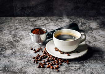 Aromatic Coffee cup and beans with ground coffee on Portafilter, Espresso coffee cup aromatic and making equipment
