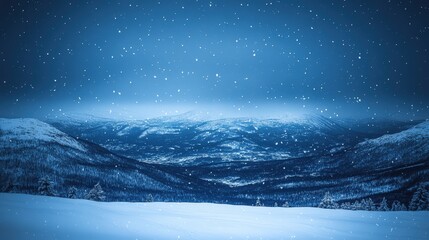 Snowfall over a vast winter mountain valley at night