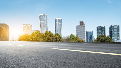 Urban City Road with Modern Skyscrapers Under Clear Blue Sky