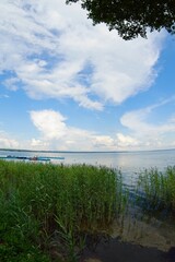    Lake Narach, Belarus, July 16, 2025. Lake shore in cloudy weather.                            
