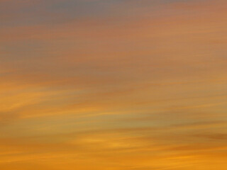 Fototapeta premium Layer of high clouds coloured by the sun at dawn 