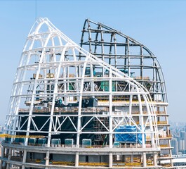 Modern skyscraper construction with unique design.