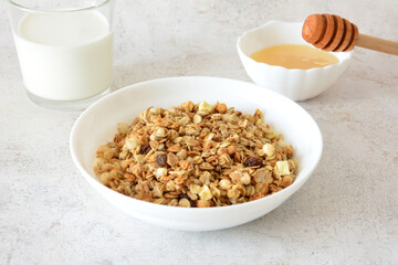 Granola in the bowl with Milk and Honey