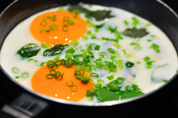 fried egg or sunny side up egg with vegetable topping