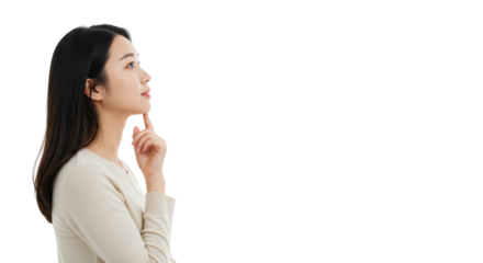 Young asian woman, early 20s, in cream knit top, contemplating with hand on chin, looking up against transparent studio background, embodying strategic insight and innovation. Concept of