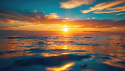 Fototapeta premium Sunset over the ocean with vibrant sky and calm water reflections. Nature and scenery, tranquility, soft colors, and breathtaking view.