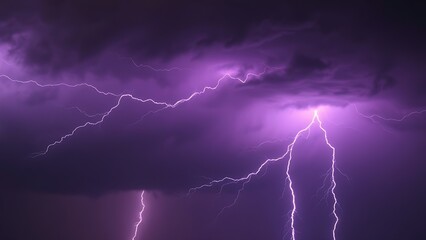 Dramatic purple lightning illuminating a stormy night sky, capturing raw natural energy.
