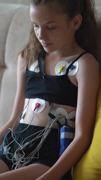 Medical heart monitoring device, Holter sensors. close up of girl with medical equipment undergoing heart examination. Heart monitoring,