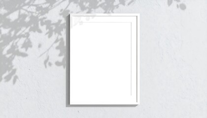 White frame mockup on a light gray wall with leaf shadows