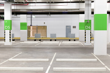 Parking garage interior, neon lights in dark industrial building