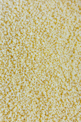 Vertical Macro of Dry Durum Wheat Couscous Filling the Frame