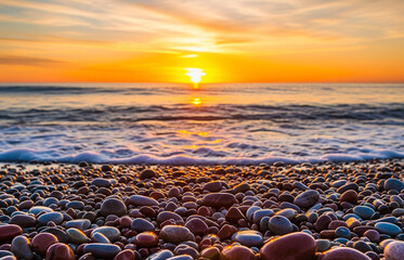 Obraz premium A tranquil coastal scene at sunset, featuring a calm ocean. Dreamlike, orange, sunset between rocks in the sea.