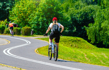 Fototapeta premium Cyclist ride on the bike path in the city Park 