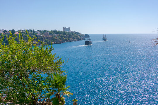 Blue ocean with two boats in the water - Powered by Adobe