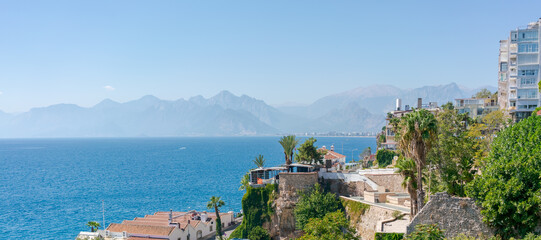 Beautiful blue ocean with a mountain range in the background