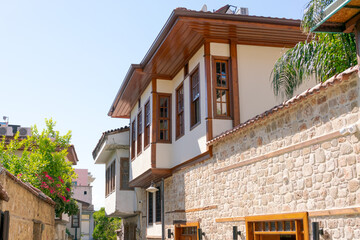 House with a brown roof and a white wall