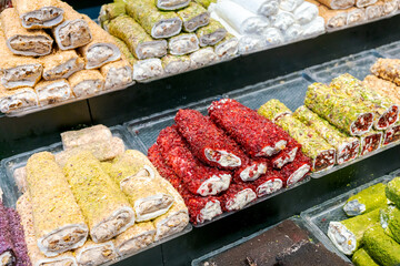 Display of various types of pastries, including some that are green