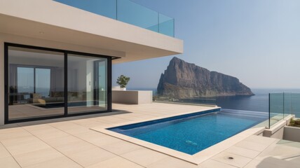 Obraz premium Luxury villa with infinity pool overlooking the sea and a rocky island