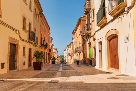 Altafulla, main street with colorful facades on the Costa Dorada, Tarragona, Spain.