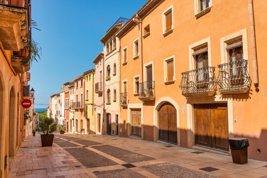 Altafulla, main street with colorful facades on the Costa Dorada, Tarragona, Spain.