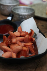 Appetizer of Fried Red Sausage with Ketchup