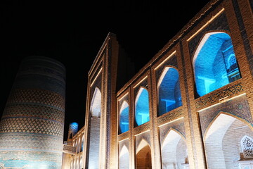 Kalta-minor Minaret and Walled Fortress known as Itchan Kala in Khiva, Uzbekistan -...