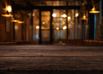 Wooden table in a warm and inviting cafe or restaurant atmosphere with soft lighting and blurred background