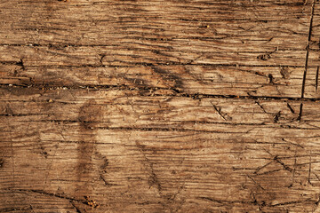Wooden surface showing natural texture and patterns from years of wear and exposure to elements