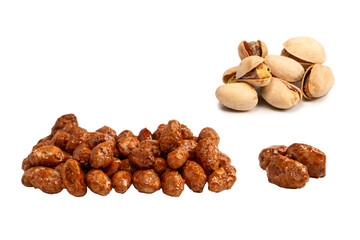 Tasty sweet roasted peanuts isolated on a white background.