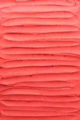 Top view of red buttercream for decorating cake, silky smooth american buttercream with patterns, overhead view of smooth red buttercream