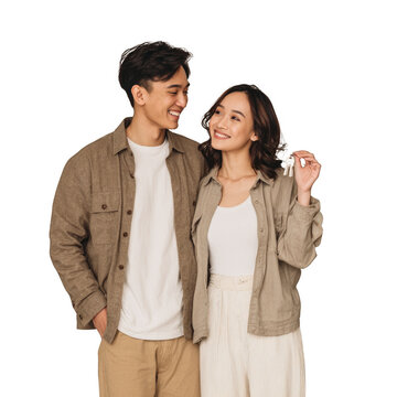 A man and a woman are smiling at the camera
