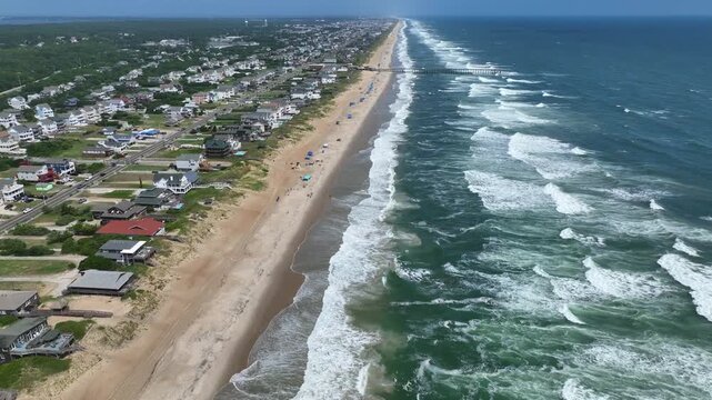 Outer Banks, NC Kill Devil Hills beach houses and real estate on coastline popular summer vacation destination for relaxing by the beach