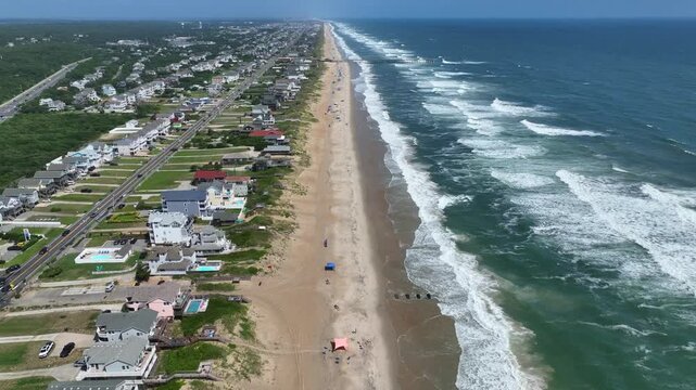 Outer Banks, NC Kill Devil Hills beach houses and real estate on coastline popular summer vacation destination for relaxing by the beach