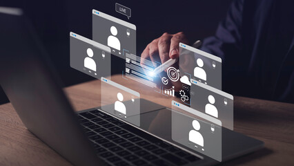 Hybrid work concept featuring a business person interacting with digital analytics during an online...