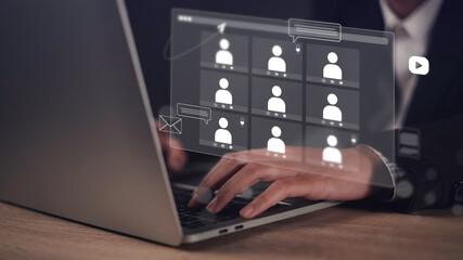 Remote work concept showing a business professional attending a virtual meeting via laptop in a modern home office. The scene digital communication, video conferencing, and online collaboration.