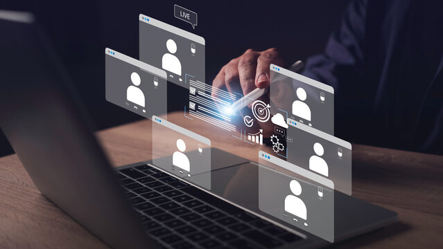 Hybrid work concept featuring a business person interacting with digital analytics during an online video conference. Virtual teamwork, remote collaboration, and modern work solutions.