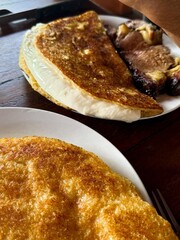 Traditional Venezuelan Cachapa with Cheese and Roasted Pork
