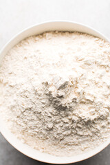 overhead view of All purpose flour in a bowl, top view of baking flour	
