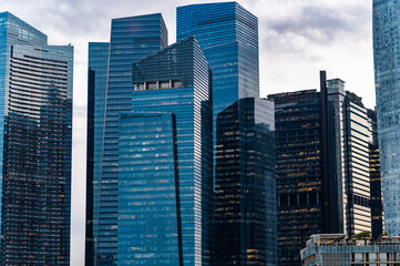 Futuristic glass skyscrapers in dense business district, Singapore, Asia