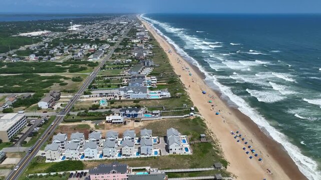Outer Banks, NC Kill Devil Hills beach houses and real estate on coastline popular summer vacation destination for relaxing by the beach