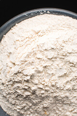 overhead view of All purpose flour in a bowl, top view of baking flour