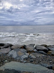Beach, rocks, and wave