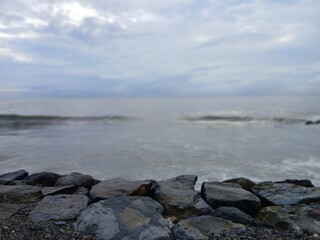 Beach, rocks, and wave