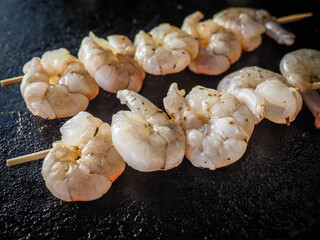 Fresh shrimp skewers prepared for grilling