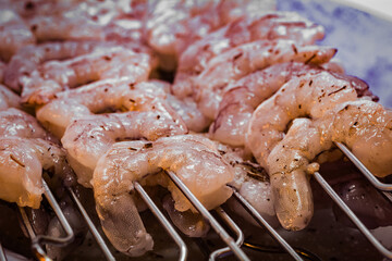 Fresh shrimp skewers prepared for grilling