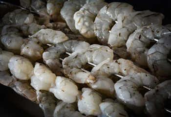 Fresh shrimp skewers prepared for grilling