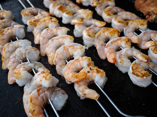 Fresh shrimp skewers prepared for grilling