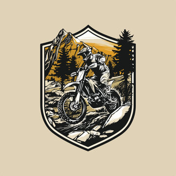 Bold badge-style logo of a white man riding a motor trail across rocky terrain with pine forest and mountain backdrop. Rugged black-white-yellow vector with dirtbike, motocross, and enduro energy.