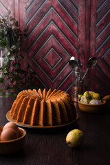 Lemon bundt cake on a wood countertop, citrus pound cake on wood background
