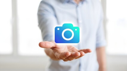 Hand holding a digital camera icon with gradient colors
